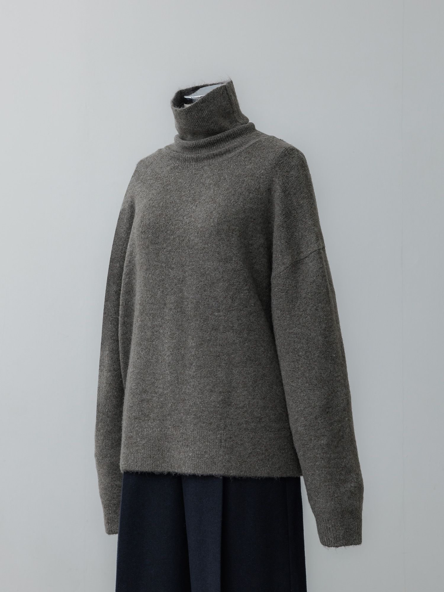 メランジハイネックルーズニット