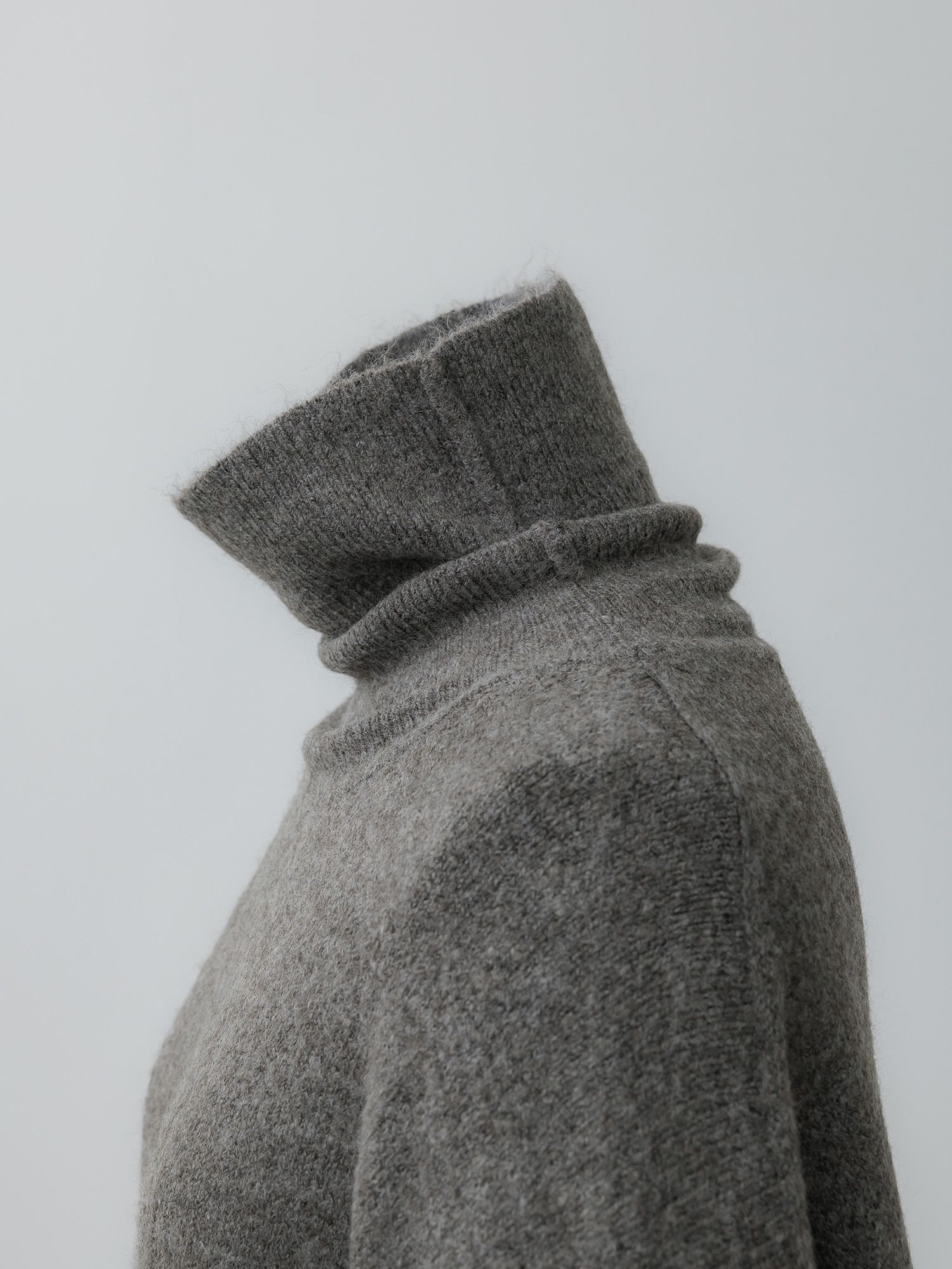 メランジハイネックルーズニット