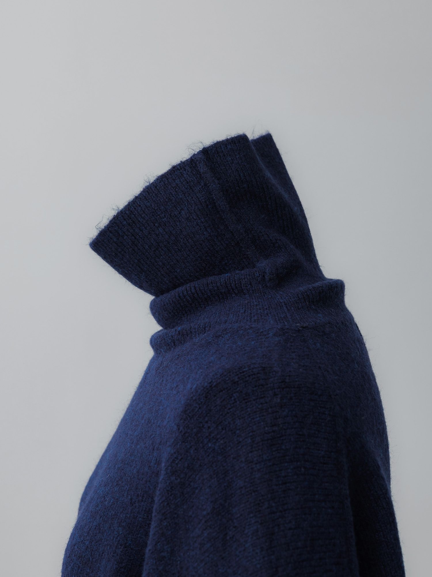 メランジハイネックルーズニット