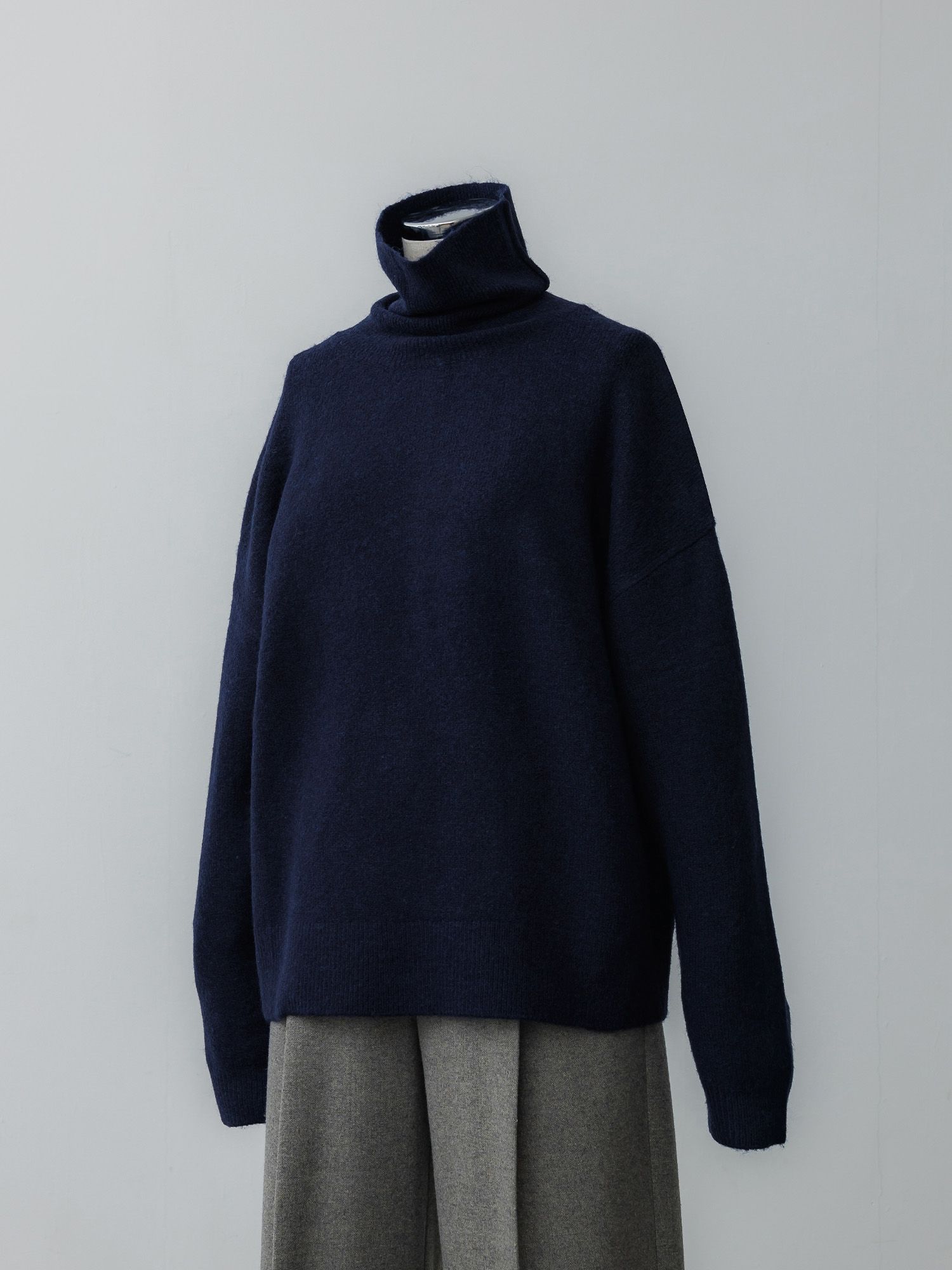 メランジハイネックルーズニット